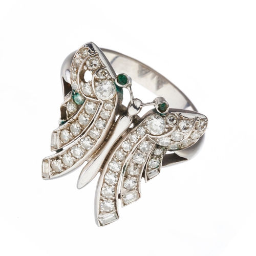 67 - A mid 20th century vari-cut diamond butterfly ring, with green gem eyes, estimated total diamond wei... 