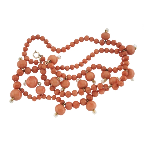 75 - An early to mid 20th century coral bead fringe necklace, with seed pearl drop highlights, wearable l... 