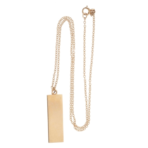 82 - A 9ct gold ingot pendant, suspended from a 9ct gold chain, hallmarks for London 1976, length of pend... 