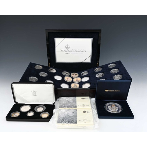 121 - A large collection of silver proof coins, Britannia mint commemorative crowns etc. original boxes an... 