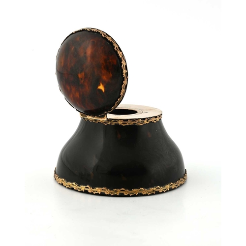 131 - An Edwardian tortoiseshell inkwell, with gold-coloured metal mounts, the exterior applied with a pie... 