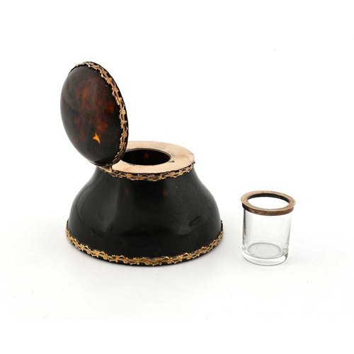 131 - An Edwardian tortoiseshell inkwell, with gold-coloured metal mounts, the exterior applied with a pie... 