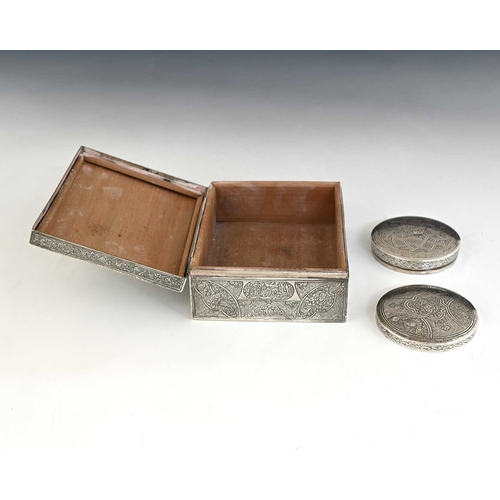 134 - Two Egyptian silver boxes, each decorated with traditional scrollwork, the rectangular cigarette box... 