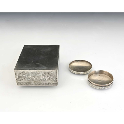 134 - Two Egyptian silver boxes, each decorated with traditional scrollwork, the rectangular cigarette box... 