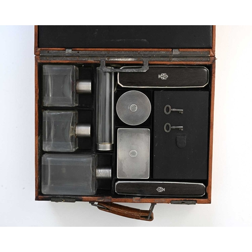 142 - A French silver gentleman's travelling dressing case, the leather case ensuite with first standard s... 