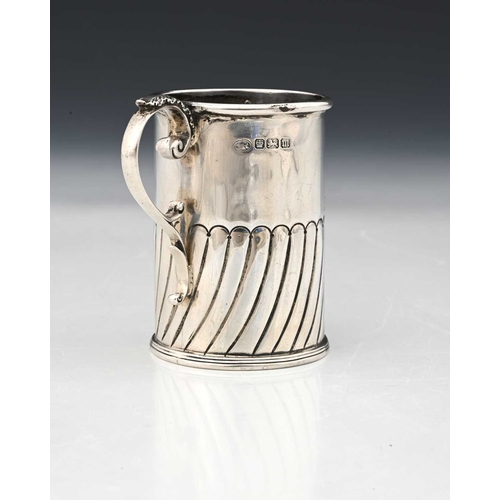 149 - An Edwardian silver mug, of cylindrical form, decorated with semi-fluting, with inscription dated 19... 