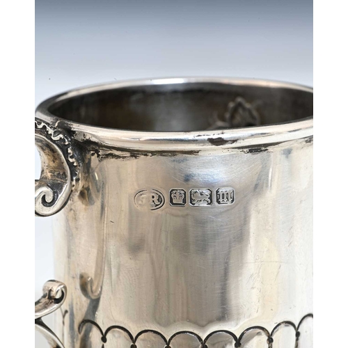 149 - An Edwardian silver mug, of cylindrical form, decorated with semi-fluting, with inscription dated 19... 