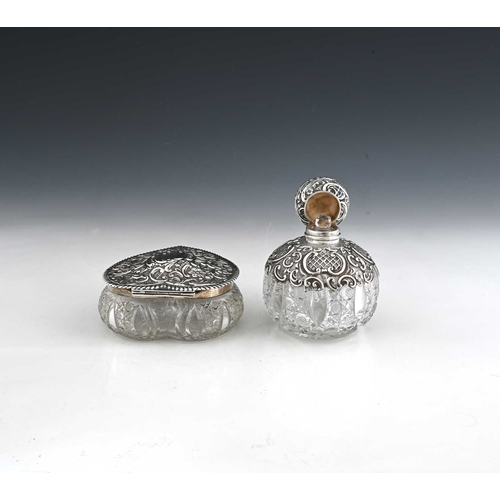 155 - A Victorian silver-mounted cut glass scent bottle, of grenade form, the silver decorated with diaper... 