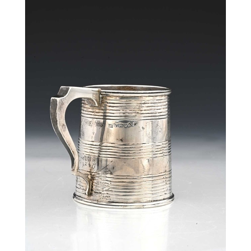 157 - A George III English provincial silver mug, of tapered cylindrical form, decorated with coopered ban... 