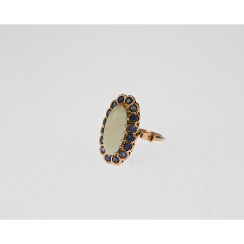 16 - An early 20th century gold opal cabochon and sapphire cluster ring, with grooved band, ring size L1/... 