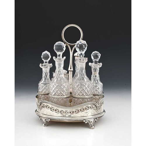 163 - A Victorian Neoclassical-style cruet set, with six cut glass bottles, the stand with wood base and p... 