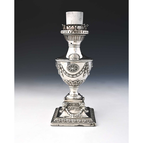 168 - A Victorian silver lamp base, in the Neoclassical style, decorated with ram's heads, floral garlands... 