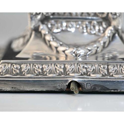 168 - A Victorian silver lamp base, in the Neoclassical style, decorated with ram's heads, floral garlands... 