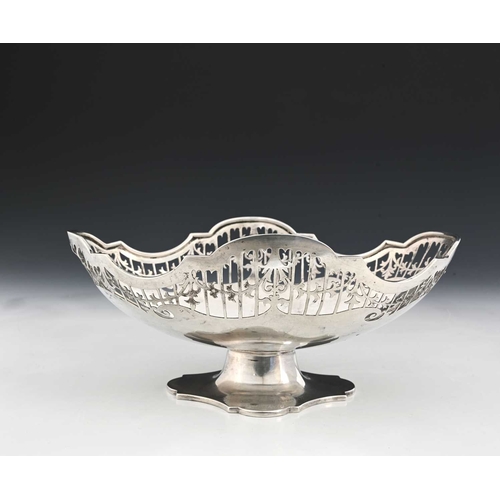 170 - A George V silver pedestal basket, of navette form, with a pierced border depicting foliate garlands... 