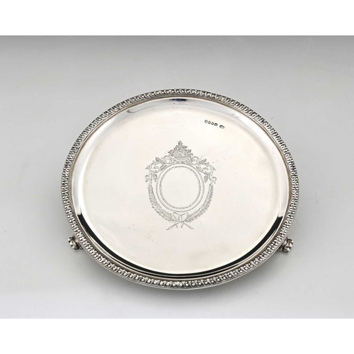 175 - A Victorian silver salver, of round form, with a cast intertwined border, the centre with vacant car... 