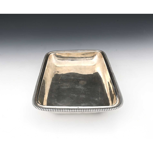 179 - A George III silver entree dish base, of rounded rectangular form, with gadroon edge border, with in... 