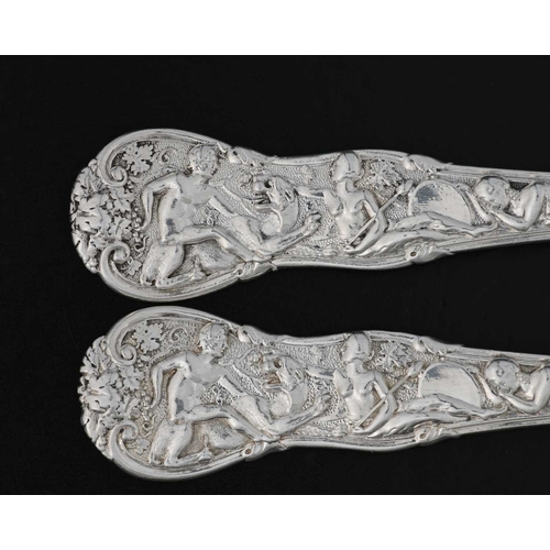 183 - Paul Storr, a set of four George IV cast silver Bacchanalian pattern entree forks, double struck, ea... 