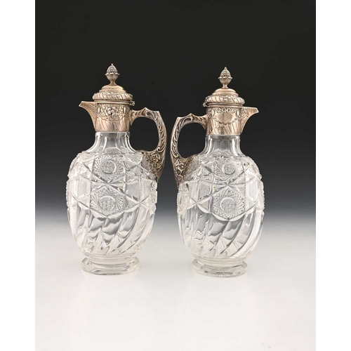 189 - A pair of Victorian silver mounted and cut glass claret jugs, Mappin Brothers, London 1898, the ovoi... 