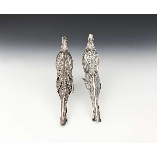 193 - A pair of late nineteenth or early twentieth-century Continental silver-coloured metal pheasant tabl... 