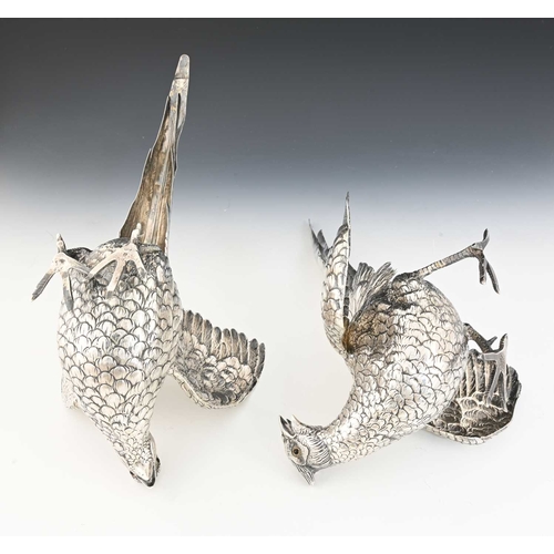 195 - A pair of late nineteenth or early twentieth-century German silver pheasant table ornaments, compris... 