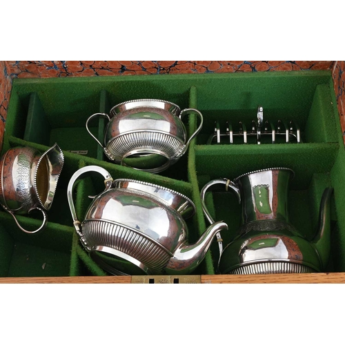 196 - A Victorian canteen, comprising a silver tea and coffee service, and a twelve-place setting of Old E... 