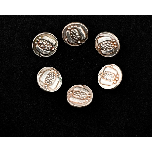 208 - Liberty and Co., a set of six Arts and Crafts silver buttons, Birmingham 1906, embossed with stylise... 