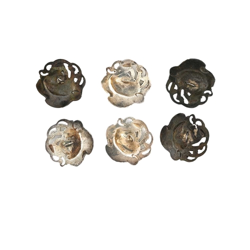 212 - A set of six Art Nouveau white metal buttons, cast and chased with a swan on open water, pierced sty... 