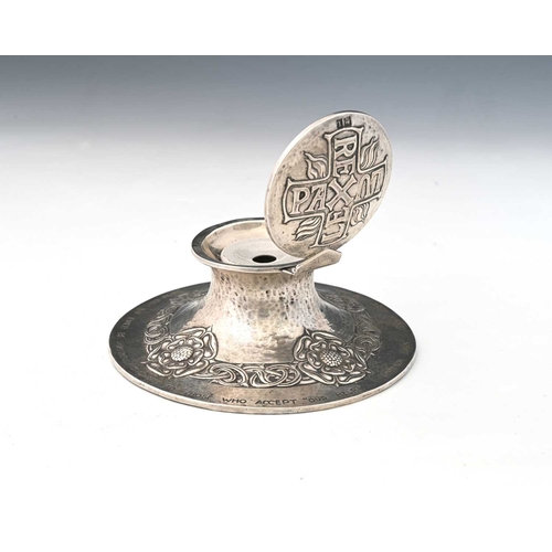 217A - Omar Ramsden and Alwyn Carr, an Arts and Crafts silver inkwell, London 1906, capstan form, planished... 