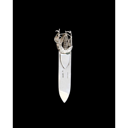 219 - An Arts and Crafts silver bookmark, J Dudley of Southsea, London 1900, the finial modelled in relief... 