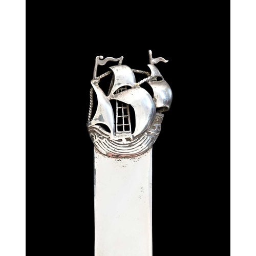 219 - An Arts and Crafts silver bookmark, J Dudley of Southsea, London 1900, the finial modelled in relief... 