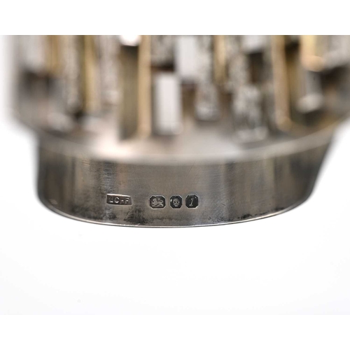 227 - A Modernist silver and parcel gilt napkin ring, LC-F, London 1966, double arched band form with text... 