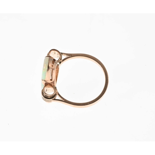 23 - A 1940s gold opal cabochon single-stone dress ring, opal measures approximately 21.3 by 11.2 by 3.8m... 