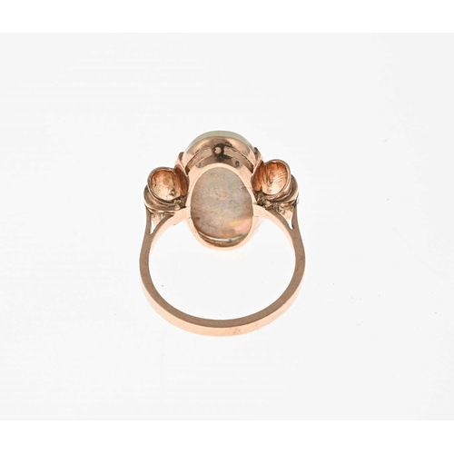 23 - A 1940s gold opal cabochon single-stone dress ring, opal measures approximately 21.3 by 11.2 by 3.8m... 