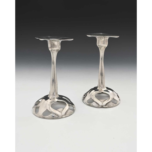 233 - Orivit, a pair of Jugendstil pewter candlesticks, organic form with naturalistic petal sconces, on o... 