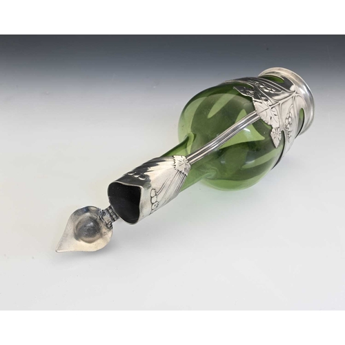 234 - Orivit, a Jugendstil pewter mounted green glass claret jug, shouldered form encased with straps of r... 