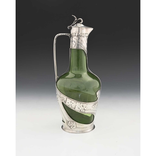 234 - Orivit, a Jugendstil pewter mounted green glass claret jug, shouldered form encased with straps of r... 