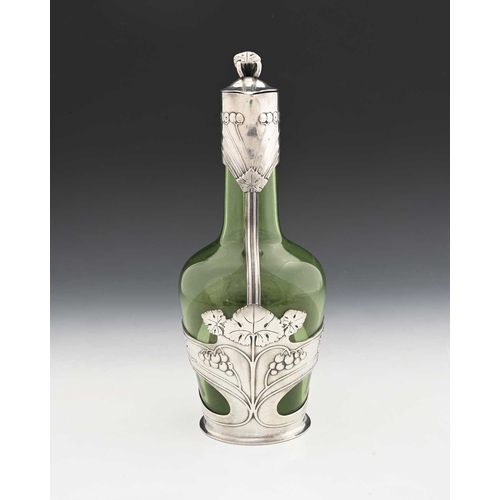 234 - Orivit, a Jugendstil pewter mounted green glass claret jug, shouldered form encased with straps of r... 