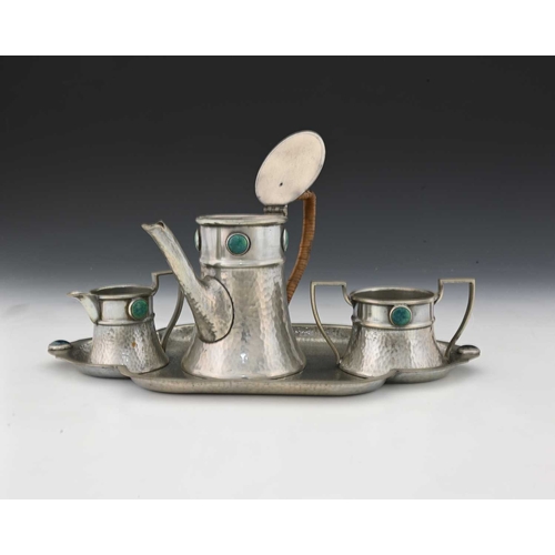 241 - An Arts and Crafts pewter and Ruskin cabochon set tea set, Ashberry Pewter circa 1915, palnished fla... 