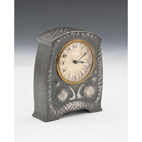 250 - Archibald Knox for Liberty and Co., a Tudric Art and Crafts pewter clock, model 01424, bombe bracket... 