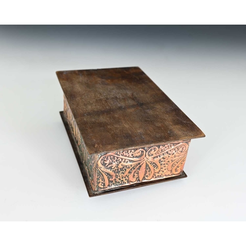 256 - An Arts and Crafts copper clad and Ruskin set box, the lid repousse embossed in relief with two grif... 