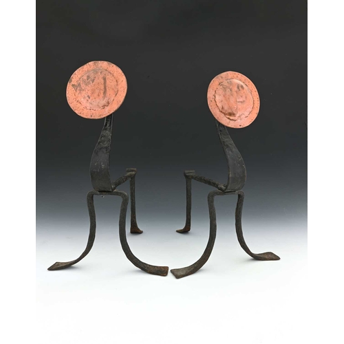 262 - A pair of Arts and Crafts copper and wrought iron andirons, swan neck form with planished roundels, ... 