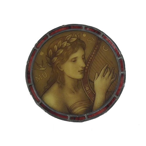 267 - A Pre Raphaelite stained glass panel, circa 1890, painted with an allegorical figure of music playin... 