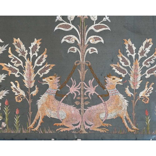 272 - A Georgian textile panel, embroidered in coloured silks with a pair of sporting dogs tethered to a s... 