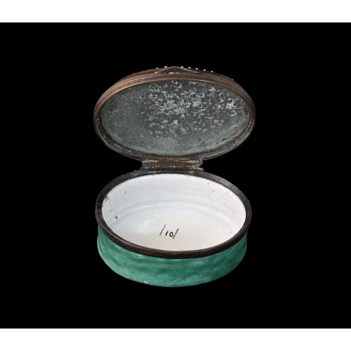 311A - A Bilston enamel patch box, circa 1790, oval form, painted with a short horned cow, within jewelled ... 