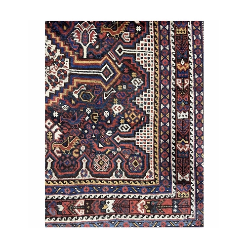 357 - A Khamseh rug, circa 1910, the three cream ground stepped medallions with animals and gemetric motif... 