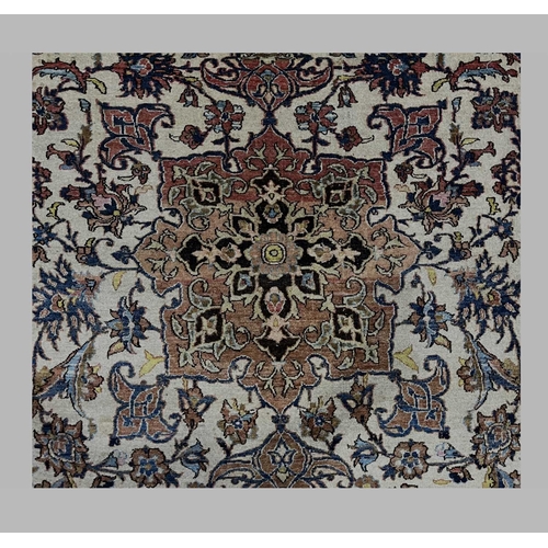 359 - A Persian Isfahan rug, the central lotus flower shaped medallion with radiating foliate tendrils, on... 