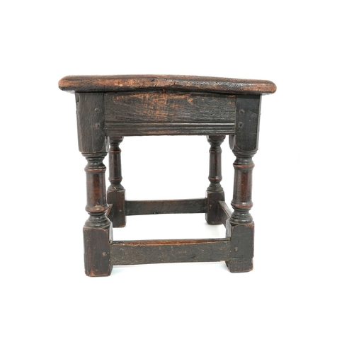 364 - An oak joint stool, probably 17th century, square panelled top on turned column legs, united by pegg... 