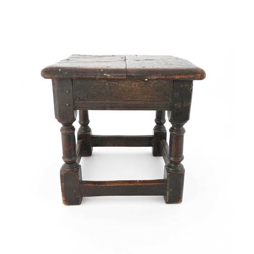 364 - An oak joint stool, probably 17th century, square panelled top on turned column legs, united by pegg... 