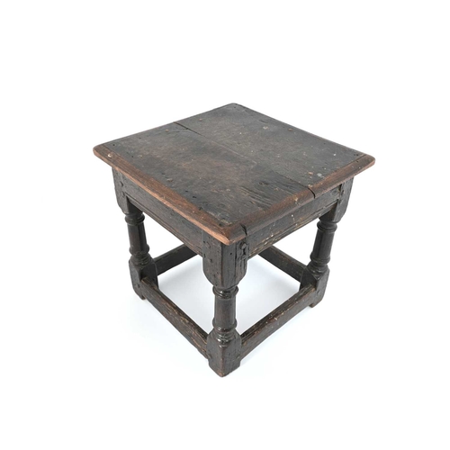 365 - An oak joint stool, probably 17th century, square panelled top on turned column legs, united by pegg... 