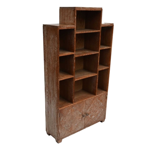 379 - An Art Deco limed oak 'skyscraper' bookcase in the manner of Heal's, circa 1930, stepped form with o... 